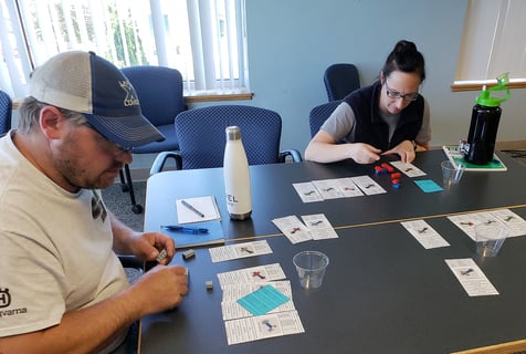 Wally and Heather assemble product during a Lean training exercise at MCL.